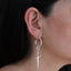 Encantos de aretes de armas